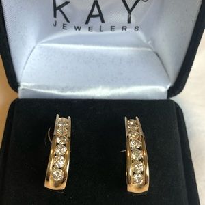 Gold diamond earrings form kay jewelry.